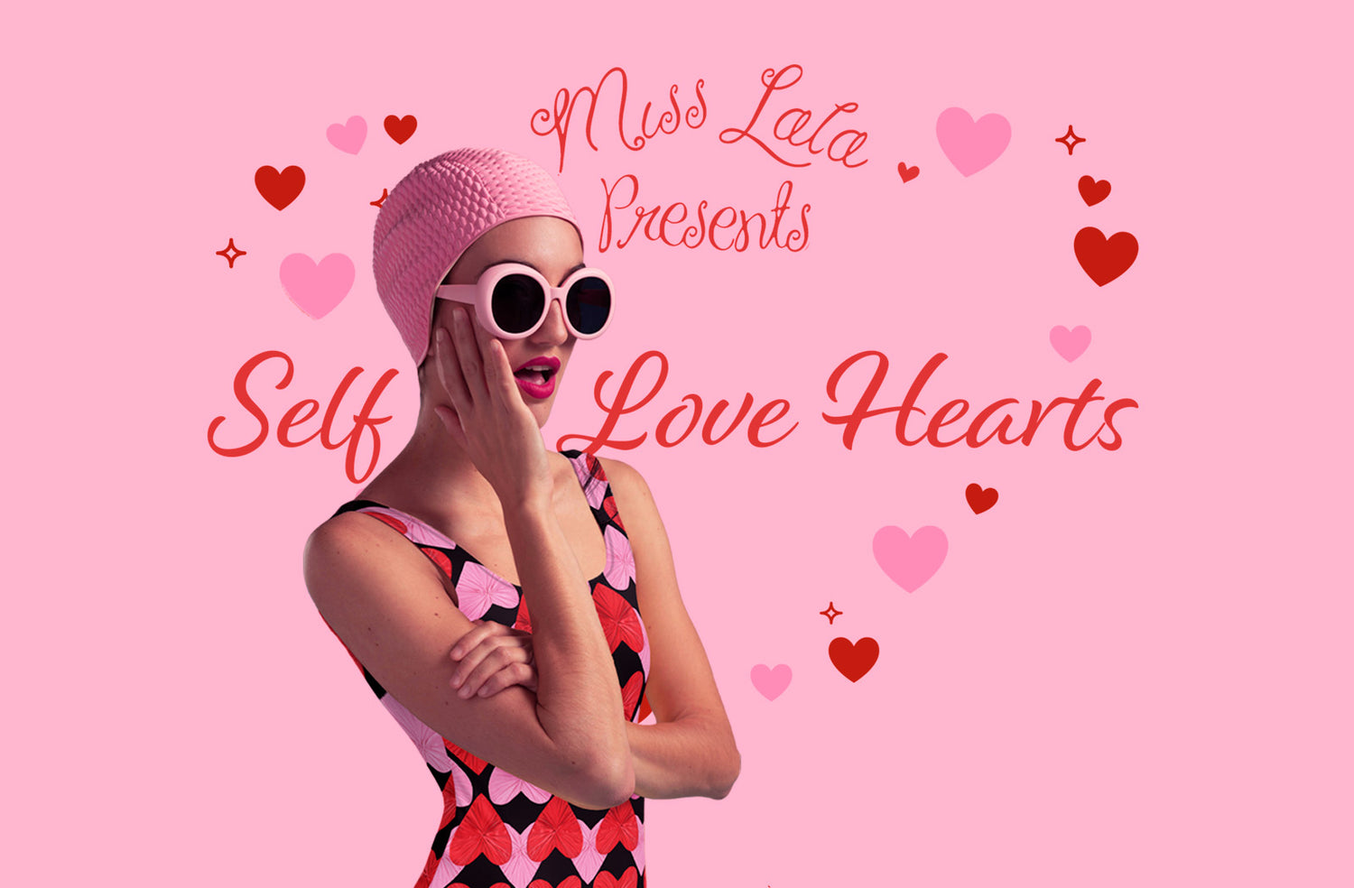 Vintage one piece swimsuit with pink and red love hearts on a black background. Retro pin up model with pink sixties glasses and a pink swimcap wears a one piece swimsuit and holds her hand to her face. The background is pink and the red text says Self Love Hearts and has heart illustrations 
